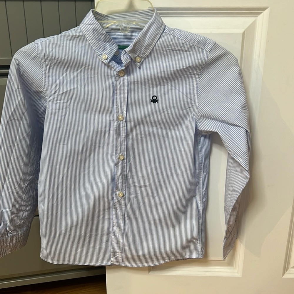 A stripped long sleeve shirt and a sweater. Size 7-8